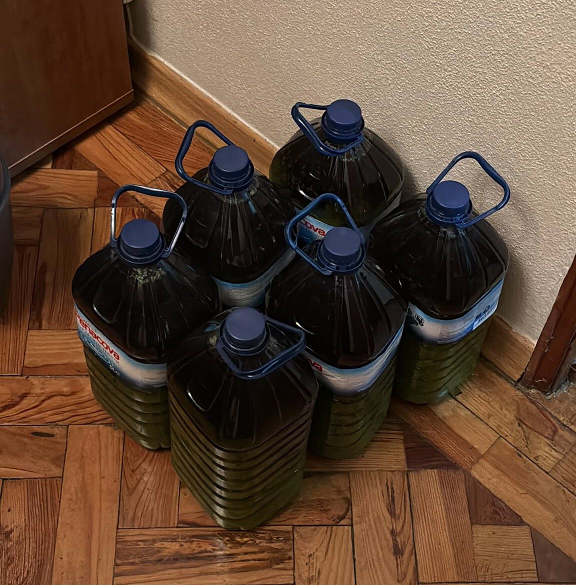 plastic bottles filled with olive oil