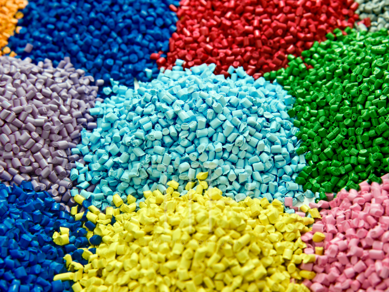 plastic pellets in red, blue, green