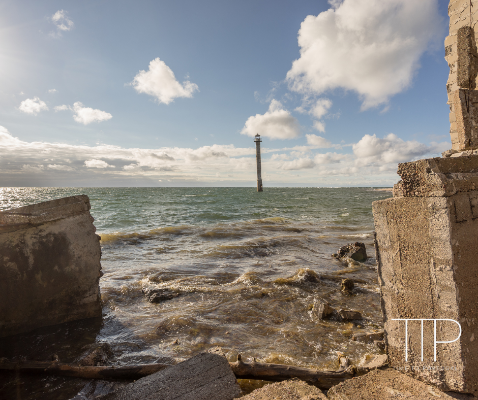 Saaremaa Coast, lighthouse in sea with ruins on coast