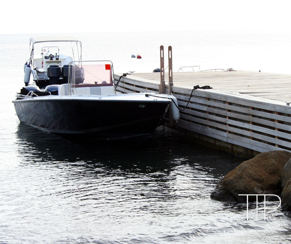 speed boat moored at pier