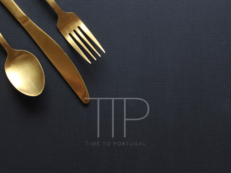 Golden fork, knife and spoon, black background