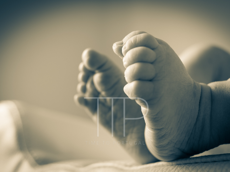 black and white image of baby feet