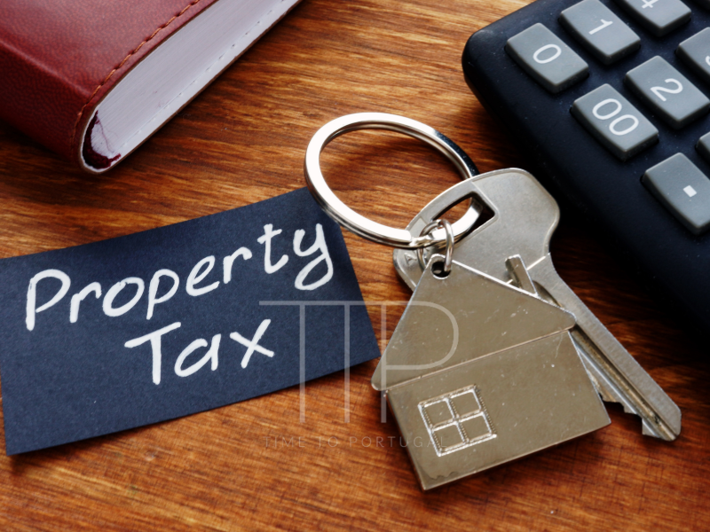 A key and a sign saying Property Tax