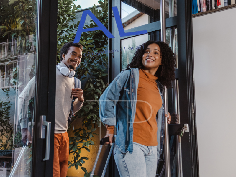 a couple entering a holiday house