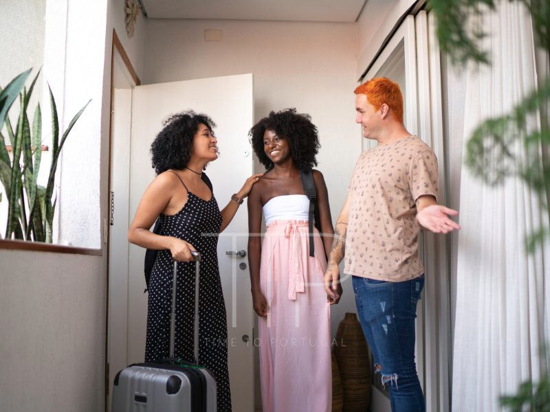 Three people in a hallway