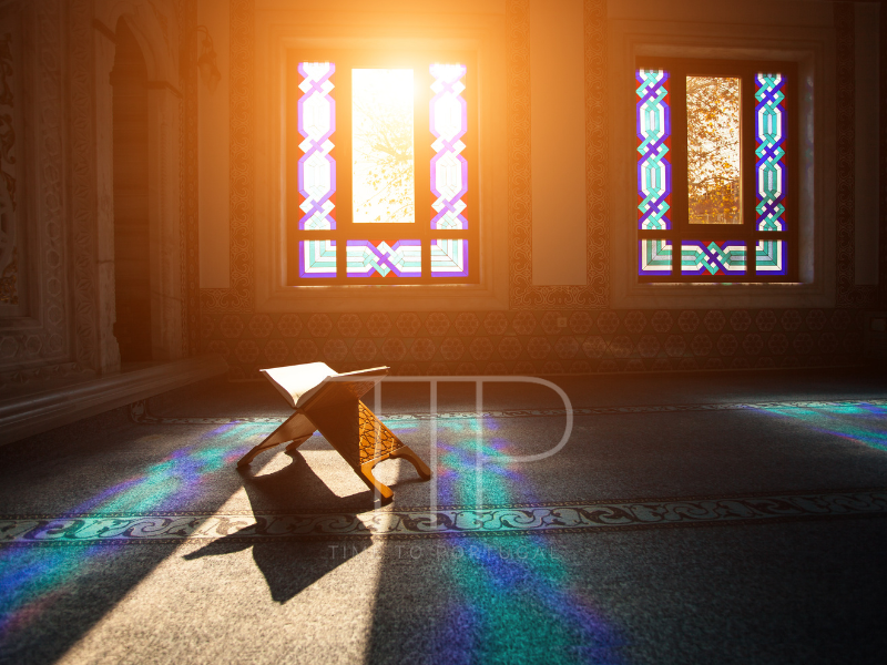 Colorful windows in mosque and the Quran
