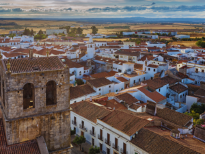 overlooking an old portuguese town with a church tower