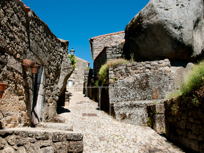 Old village path, walls and house in stone