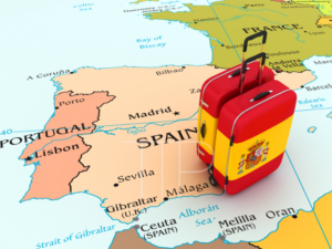 map of portugal and spain and a suitcase with spanish flag